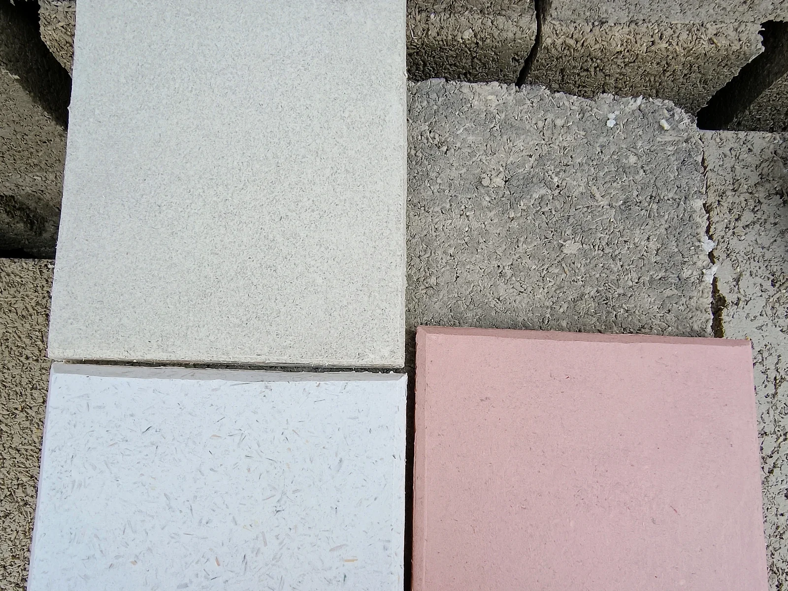 Handmade hemp plaster test panels in natural mineral colours